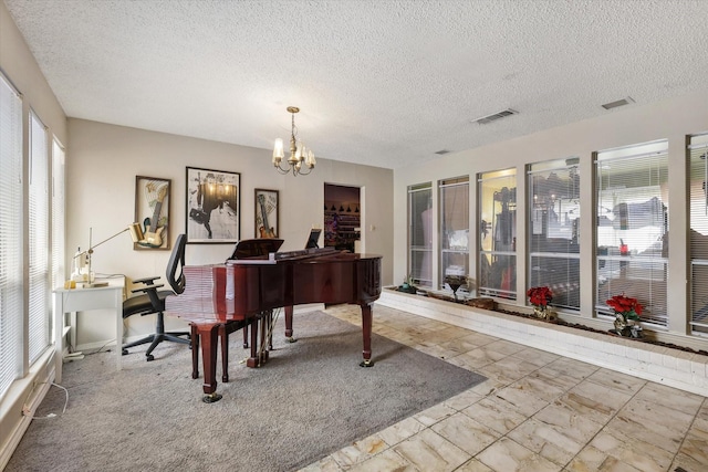 sitting room featuring a textured ceiling, marble finish floor, visible vents, and an inviting chandelier