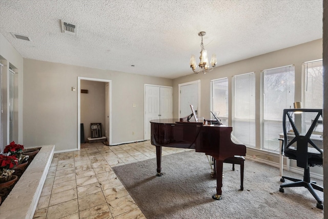 sitting room featuring a wealth of natural light, visible vents, baseboards, and an inviting chandelier