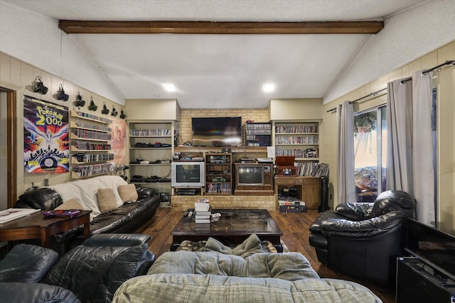 living area featuring lofted ceiling with beams, dark wood-style flooring, and a textured ceiling