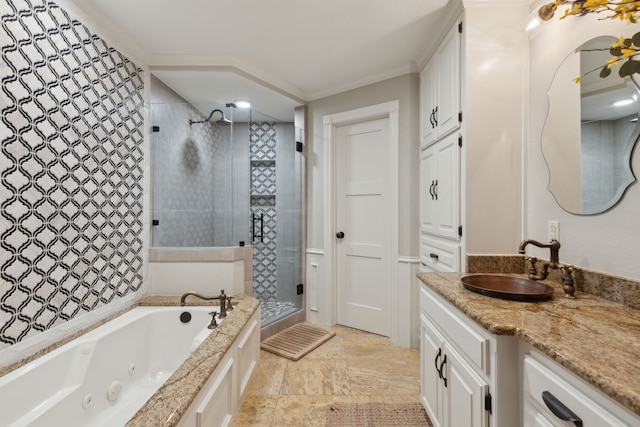 full bath with vanity, a tub with jets, a stall shower, stone finish flooring, and crown molding