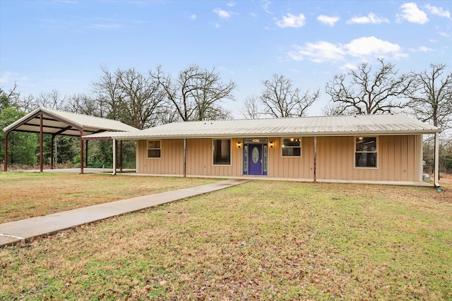 single story home with board and batten siding, a front yard, covered porch, and metal roof