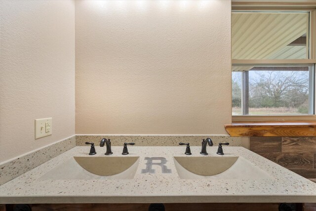 unfurnished bedroom featuring lofted ceiling, a ceiling fan, visible vents, baseboards, and unfinished concrete floors