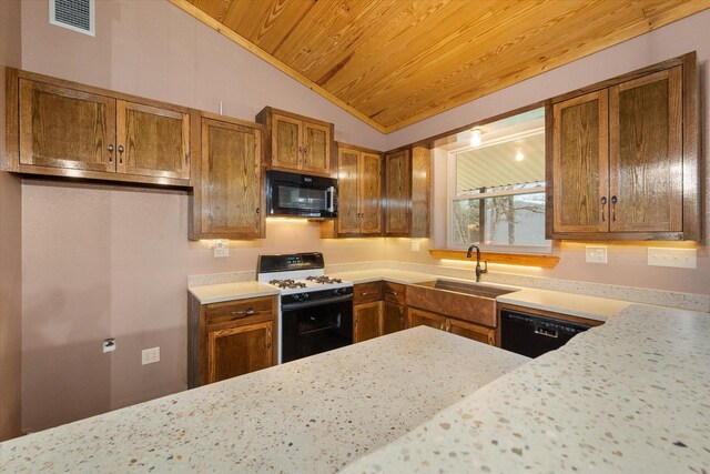 kitchen featuring a kitchen island with sink, concrete floors, open floor plan, brown cabinets, and decorative light fixtures