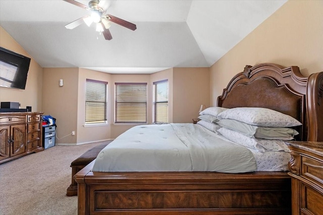 bedroom with a ceiling fan, lofted ceiling, light colored carpet, and baseboards