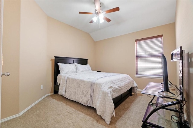 bedroom featuring vaulted ceiling, a ceiling fan, light colored carpet, and baseboards