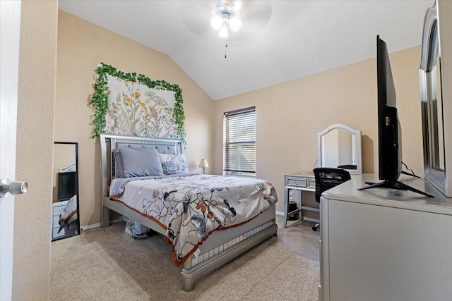 bedroom with vaulted ceiling, light carpet, a ceiling fan, and baseboards