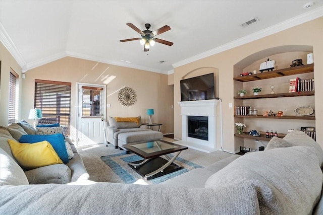 living room featuring vaulted ceiling, built in features, visible vents, and light colored carpet