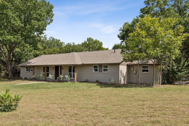 ranch-style house with a front yard and covered porch