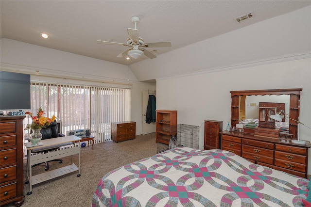 carpeted bedroom featuring lofted ceiling and visible vents