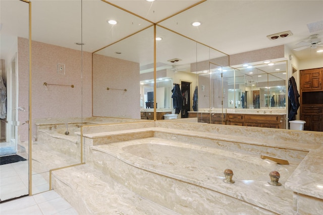 full bathroom with a ceiling fan, tile patterned flooring, vanity, a bath, and recessed lighting