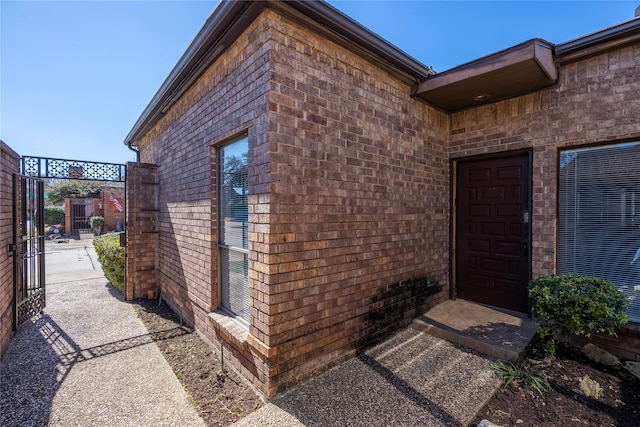 property entrance with brick siding