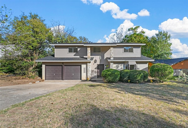 view of front of home with driveway, brick siding, an attached garage, and a front yard