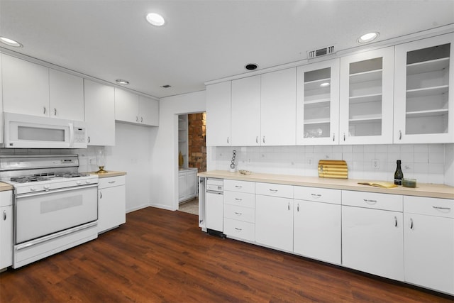 kitchen featuring dark wood-style floors, light countertops, glass insert cabinets, white cabinets, and white appliances