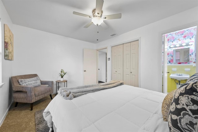 bedroom with visible vents, carpet floors, a closet, and a ceiling fan