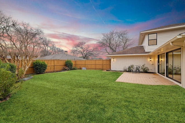 view of yard with a patio area and a fenced backyard