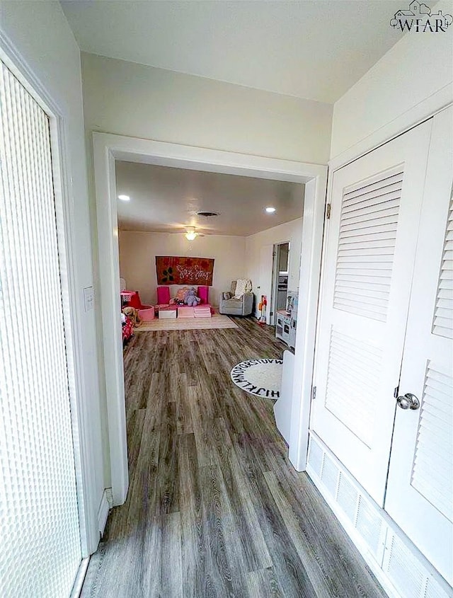 hallway with wood finished floors