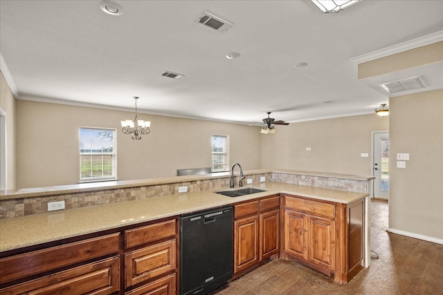 kitchen featuring black dishwasher, brown cabinets, a sink, and visible vents