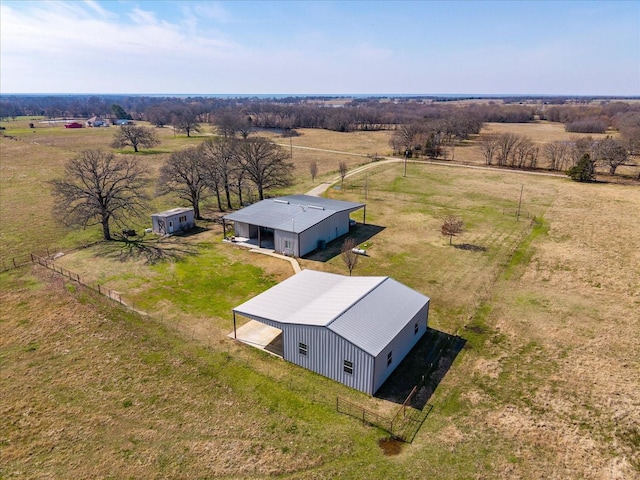 birds eye view of property with a rural view