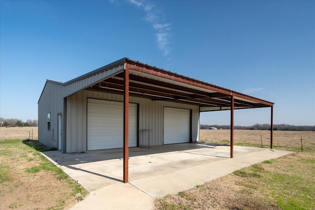 garage with a garage and a rural view