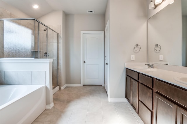 full bathroom with a garden tub, double vanity, visible vents, a sink, and a shower stall