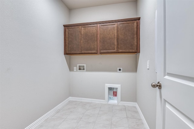 laundry room with hookup for a washing machine, cabinet space, baseboards, and hookup for an electric dryer