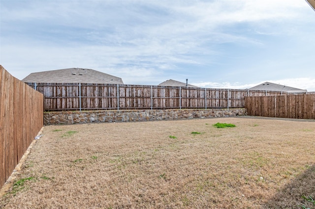 view of yard featuring a fenced backyard