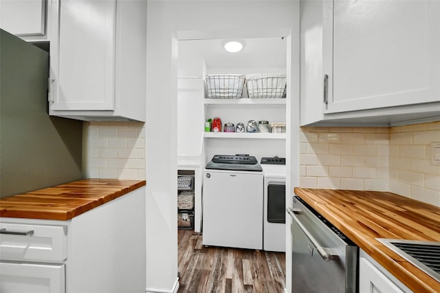 kitchen with open shelves, washing machine and dryer, white cabinets, wood finished floors, and butcher block countertops