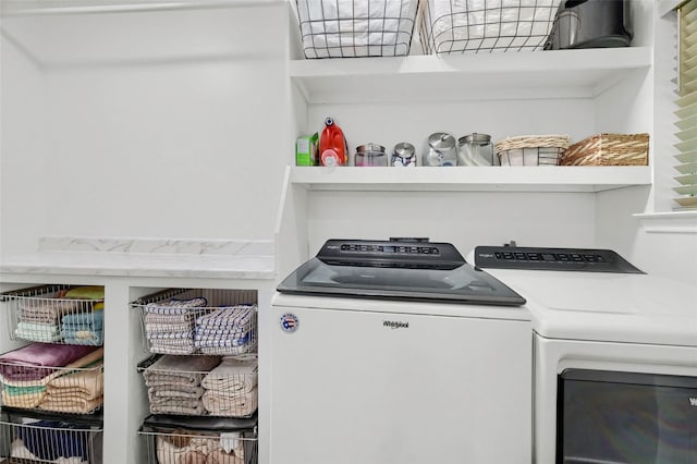 clothes washing area featuring laundry area and washer and dryer