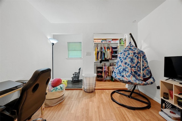 office space featuring wood finished floors and baseboards