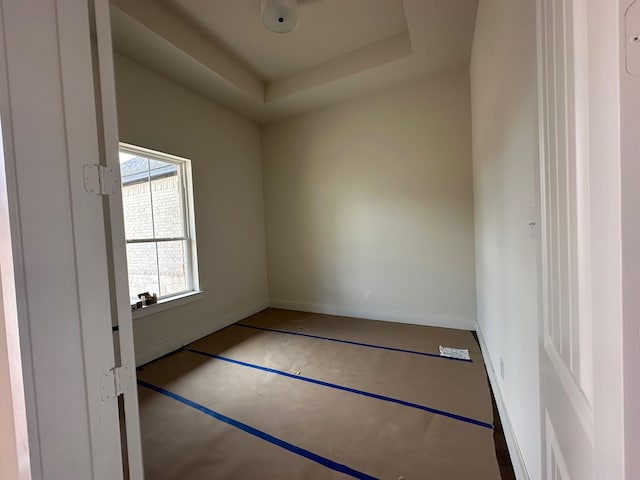 1045 Woodland Rd, Weatherford, TX 76088 - spare room featuring a raised ceiling and baseboards
