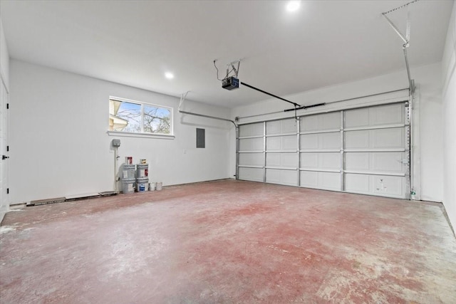 garage with a garage door opener and electric panel