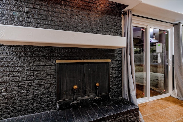 details with a fireplace with raised hearth