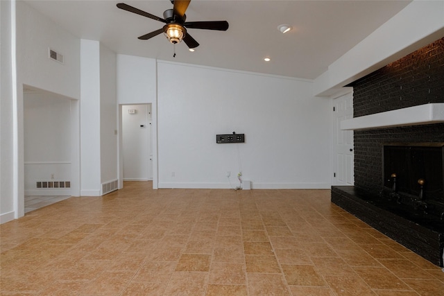 unfurnished living room with baseboards, visible vents, and a ceiling fan