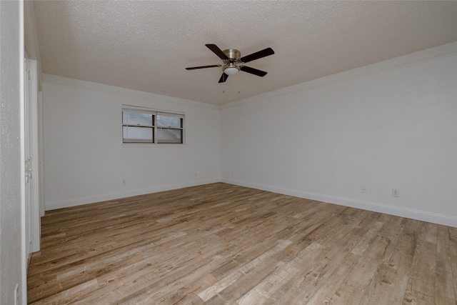 unfurnished room featuring light wood finished floors, crown molding, a textured ceiling, and a ceiling fan