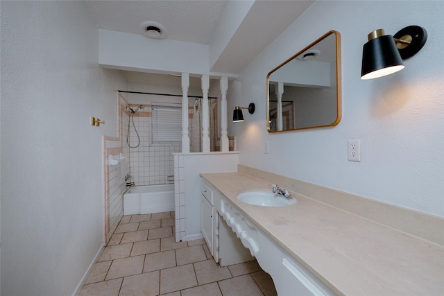 full bath featuring baseboards, shower / bathtub combination, tile patterned floors, a textured ceiling, and vanity