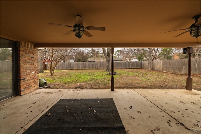 view of patio featuring a fenced backyard and a ceiling fan