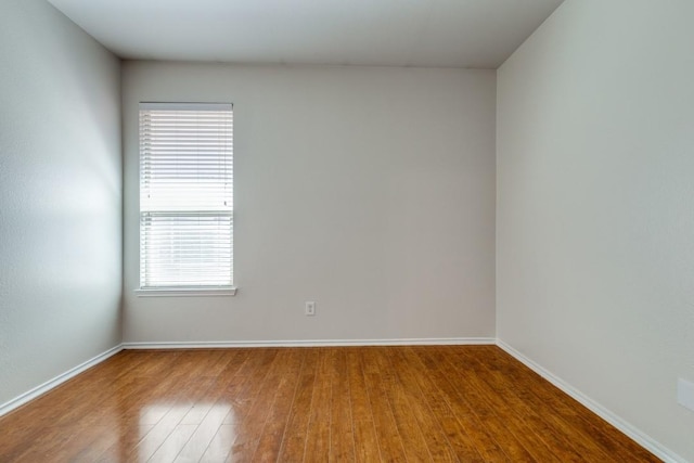 8860 Noontide Dr, Fort Worth, TX 76179 - unfurnished room featuring wood finished floors and healthy amount of natural light