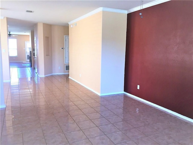 unfurnished room featuring ceiling fan, baseboards, and light tile patterned floors