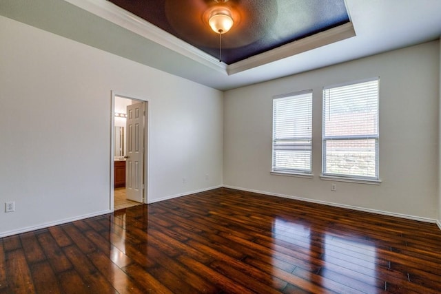 8860 Noontide Dr, Fort Worth, TX 76179 - empty room with a tray ceiling, wood-type flooring, and crown molding