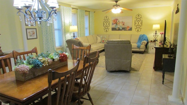 dining area with light tile patterned floors and ceiling fan with notable chandelier