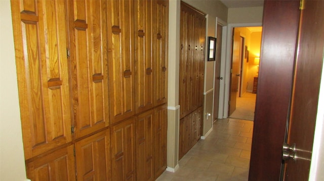 hallway with light tile patterned floors