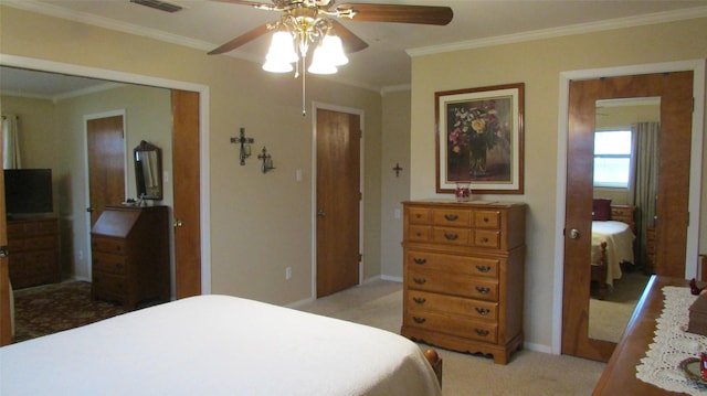 bedroom featuring ornamental molding, light carpet, visible vents, and baseboards