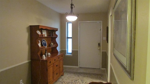 entrance foyer with light tile patterned floors