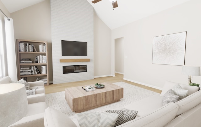 living room with high vaulted ceiling, light wood-style flooring, a fireplace, a ceiling fan, and baseboards