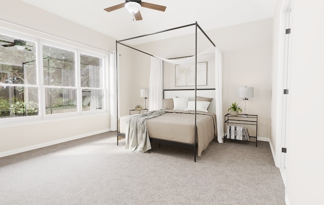 carpeted bedroom featuring ceiling fan and baseboards