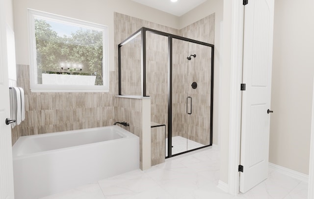 full bathroom featuring a stall shower, marble finish floor, plenty of natural light, and a bath