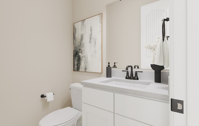 bathroom featuring toilet and vanity