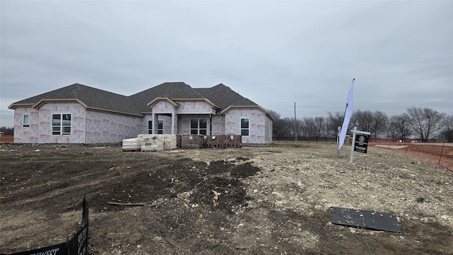 unfinished property with stone siding