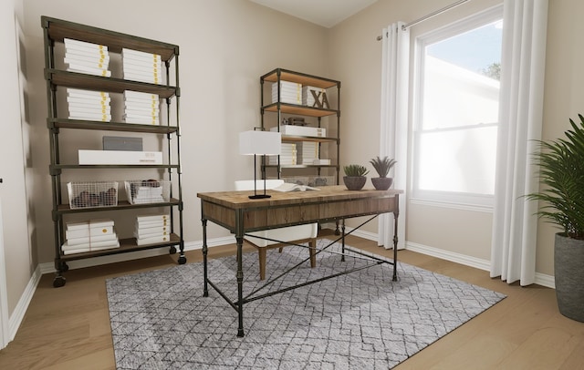 office with baseboards and light wood finished floors