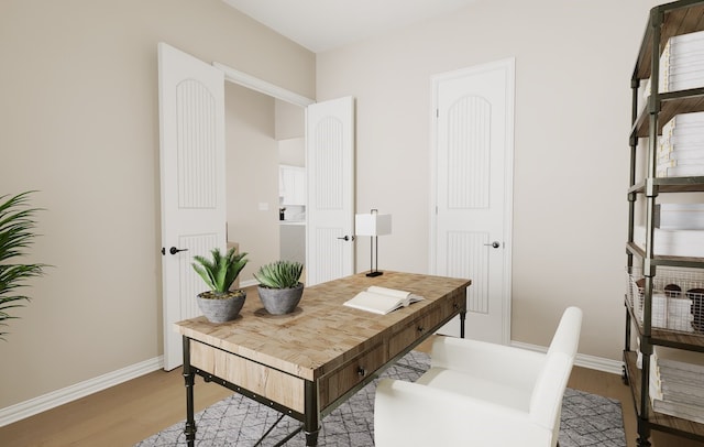 office area with light wood-style flooring and baseboards